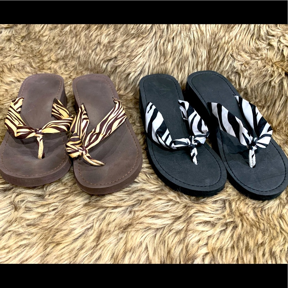 EUC - 2 pairs of animal print flip flops. Size 5.5.